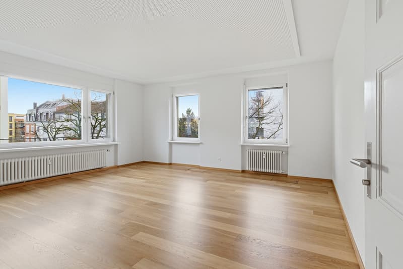 empty room, wooden floor, white walls, large windows, radiators