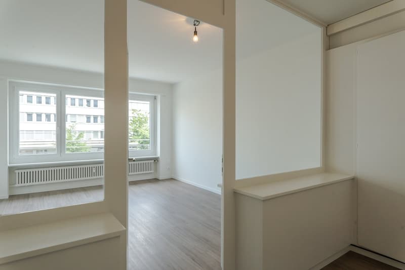 empty room, wooden floor, white walls, large windows, balcony, view of the outside