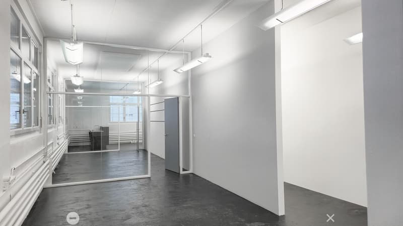 empty room with large windows and a glass wall
