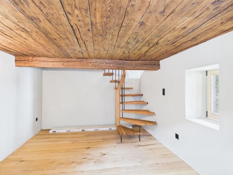 wooden ceiling, wooden floor, spiral staircase, white walls, window