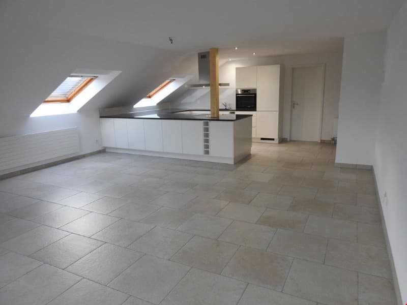empty room, kitchen, white cabinets, tiled floor, two skylights