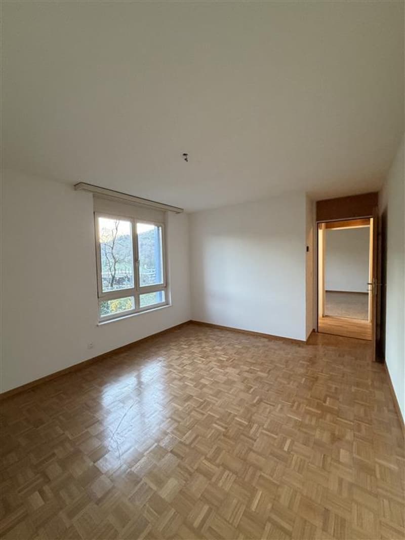 empty room, wooden floor, white walls, large window, door