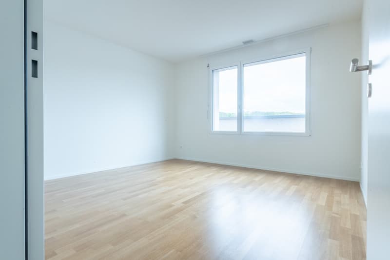 empty room, wooden floor, white walls, large window