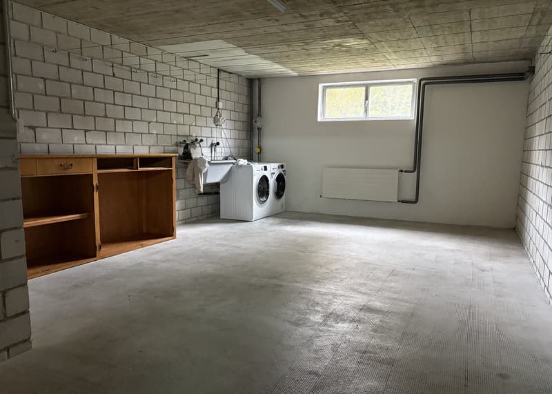 Laundry room with washing machine, dryer, and wooden cabinet