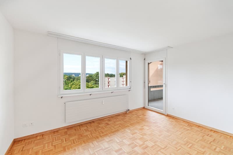 large windows, balcony, parquet floor, white walls, central heating, open door