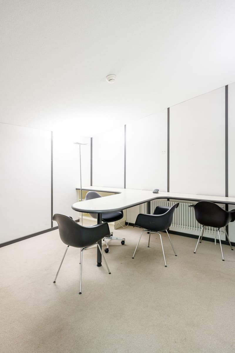 white office room, table, chairs, radiator, ceiling lamp, carpet