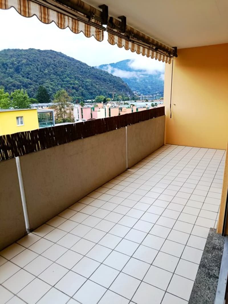 Tiled floor, awning, fenced, view of the mountains