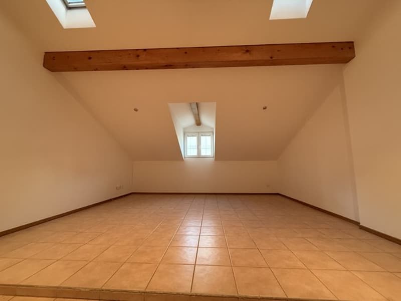 tiled floor, wooden beam, white walls, skylight windows