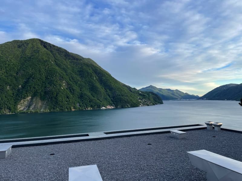 rooftop terrace overlooking lake and mountains