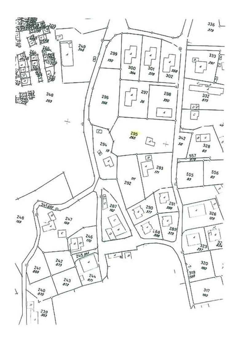 multiple lots and buildings layout, road layout with cross-streets, plot numbers, and building sizes marked