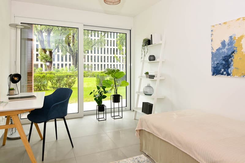 bed, desk, chair, double glass doors, plants, painting