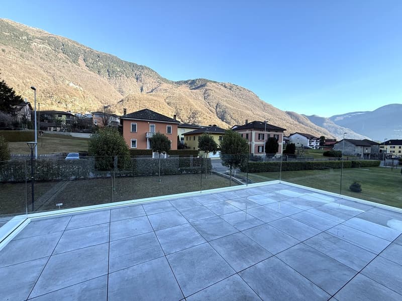 A concrete terrace with a panoramic view of the mountains