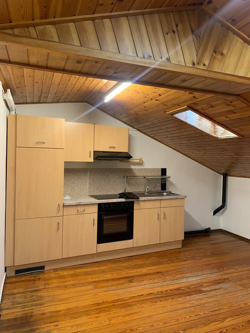 wooden floor, ceiling, kitchen cabinets, stove, oven, sink, wooden countertop, window