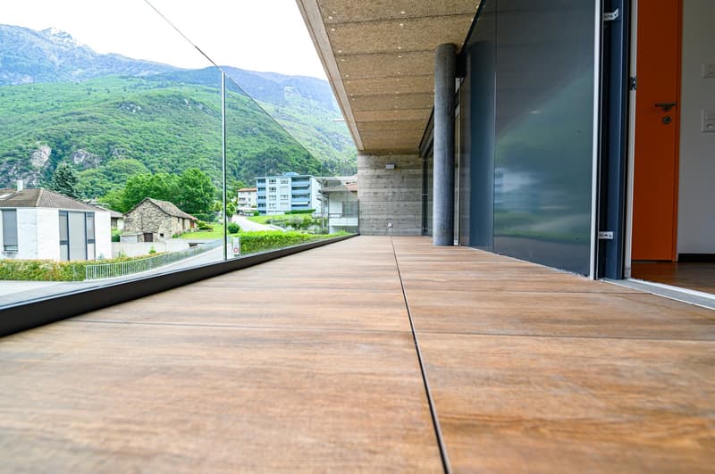 wooden floor, glass railing, open to outside, view of mountains