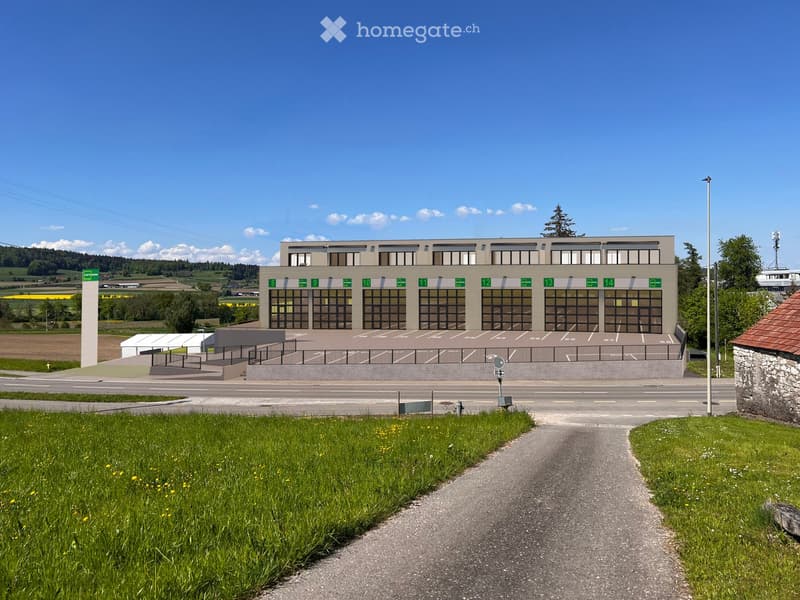 Large building with multiple windows, large parking lot, wide driveway