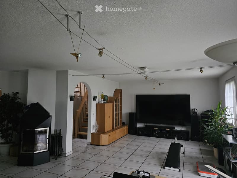 fireplace, TV, entertainment center, speakers, staircase, tiled floor