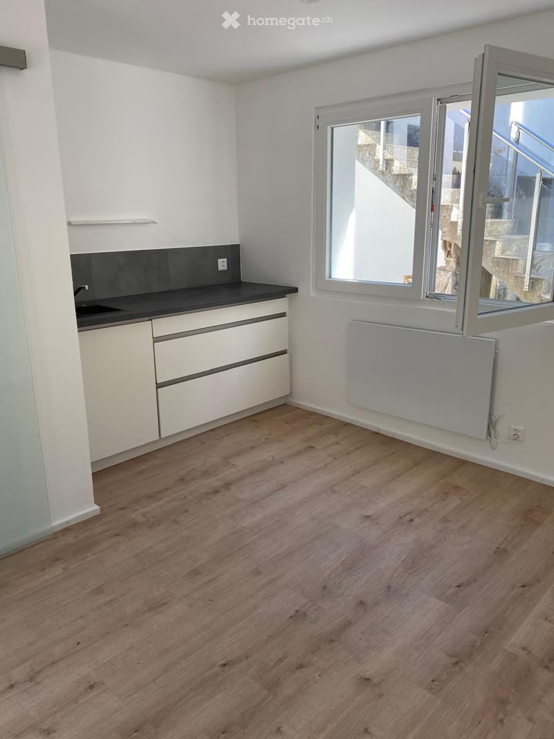 empty room with kitchen area, open window, modern design, white color