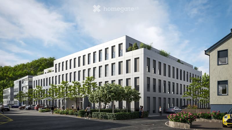 Modern white building with multiple floors, multiple windows, plants on roof, several cars parked
