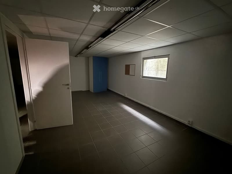 empty room, white walls, tiled floor, blue cabinet, window, door