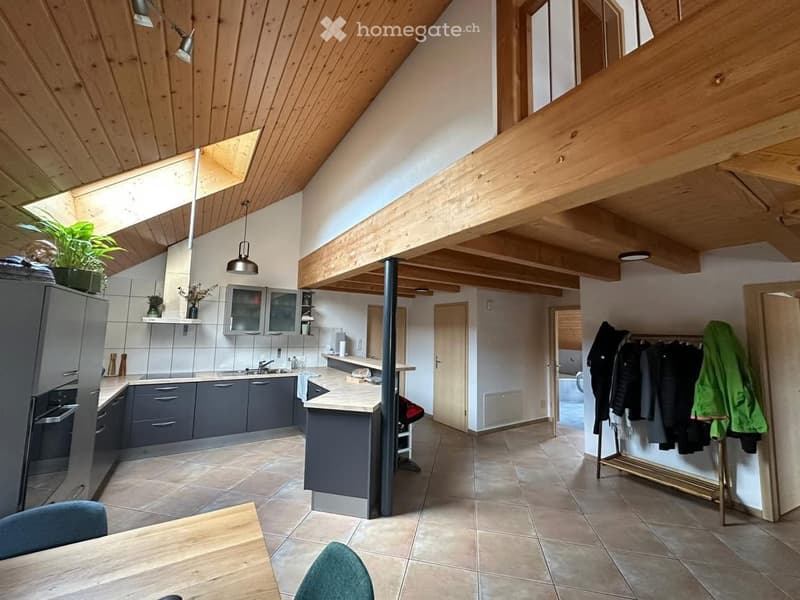 kitchen with breakfast bar, wooden beams, tiled floor, white tiled walls, kitchen appliances, hanging rack with clothes, large windows