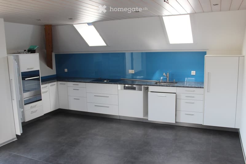 kitchen, modern, white cabinetry, blue backsplash, granite countertop, stainless steel sink, dishwasher, black tile flooring
