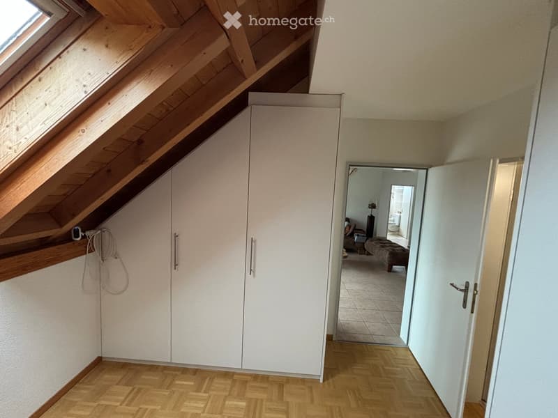 wooden ceiling, white wardrobes, wooden floor, open door, daylight from window
