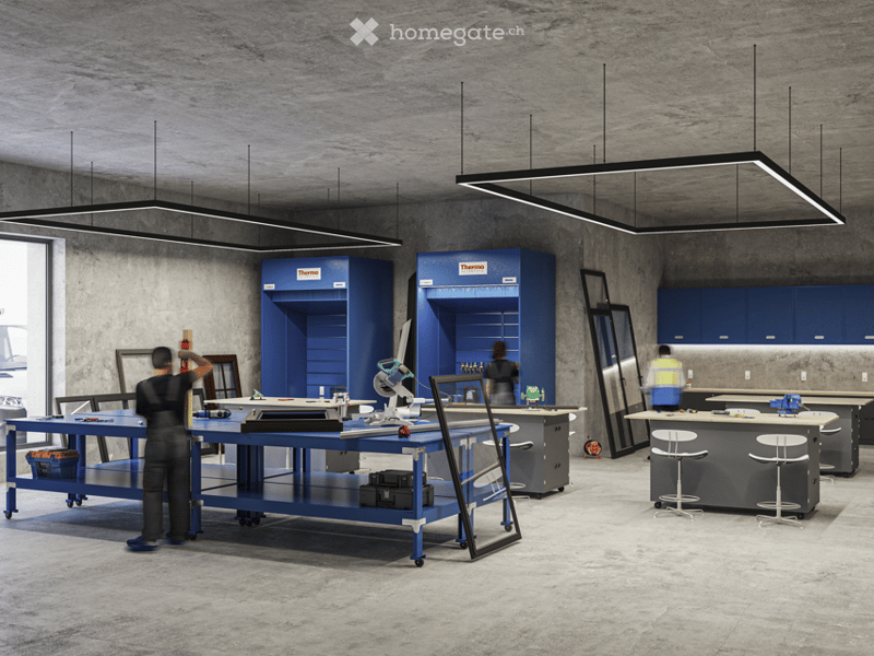 Industrial workshop with blue cabinets, workbenches, and overhead lighting.