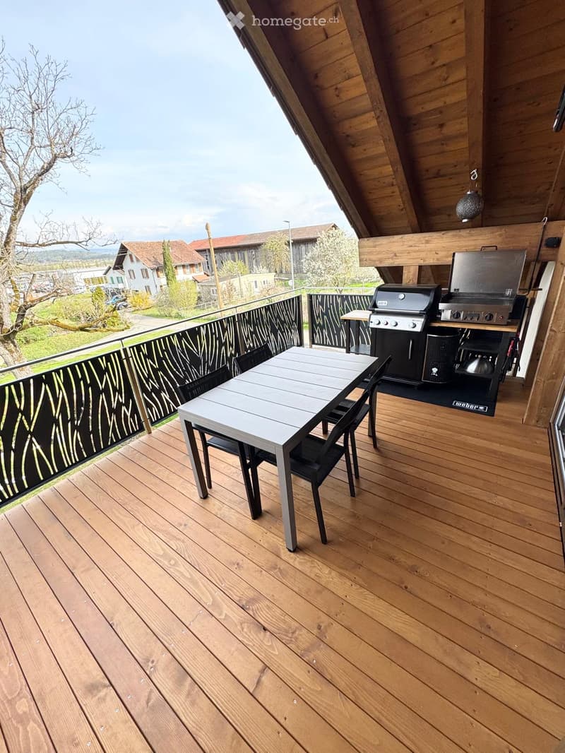 wooden deck, table and chairs, grill, metal railings, view of the landscape