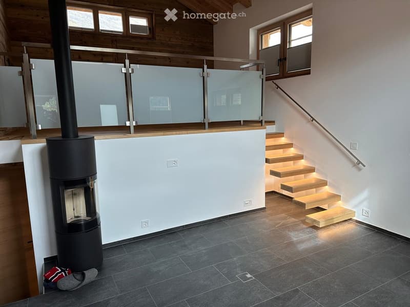 modern interior, fireplace, wooden staircase, glass railing, white walls, gray floor