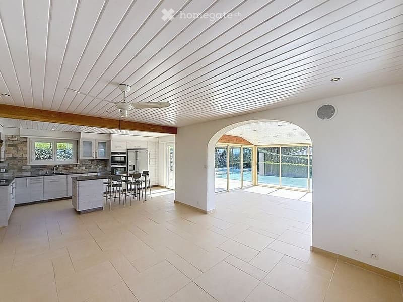 Open kitchen, dining area, living room, swimming pool, large windows
