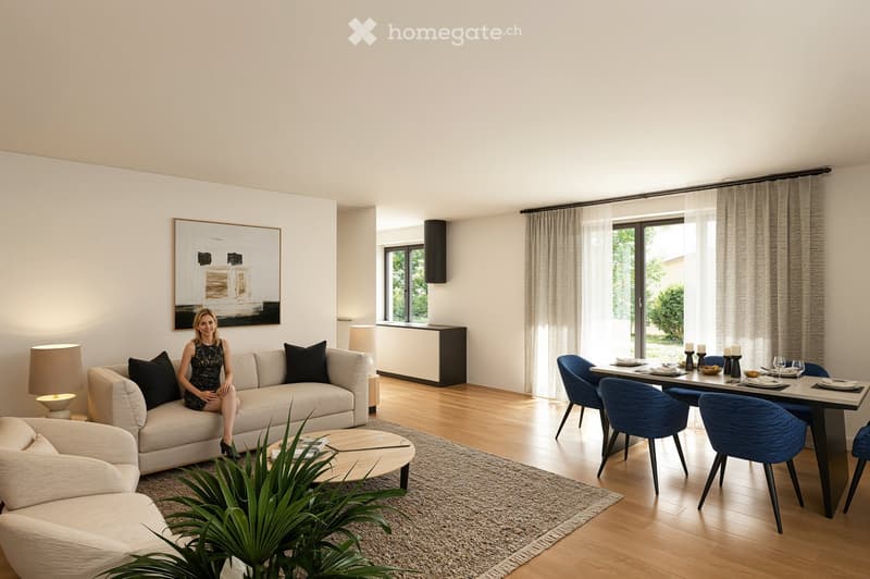 Modern living room with a couch, coffee table, and a dining area with a table and chairs.