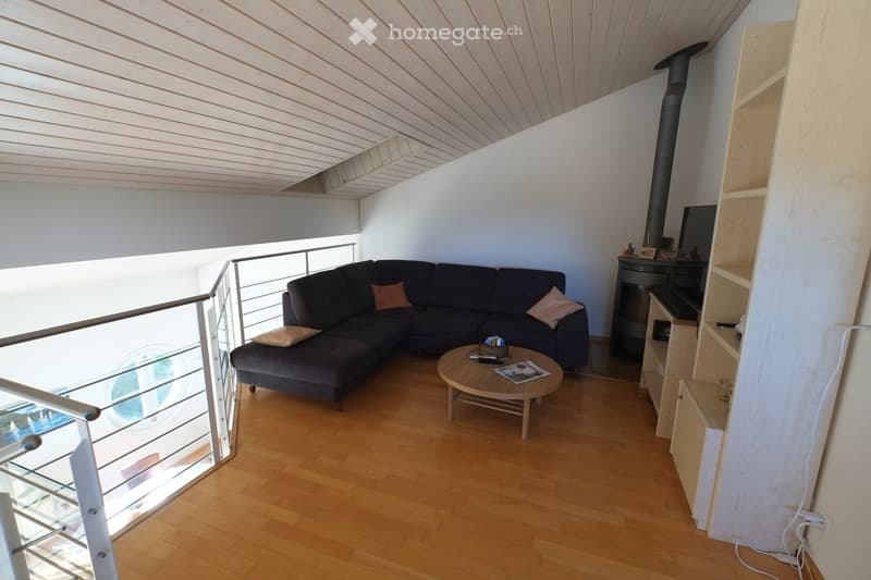 L-shaped sofa, coffee table, fireplace, wooden floor, balcony, glass window, wooden ceiling
