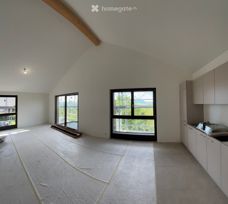 Furnished Room. Bright, open room with white tiled floors, large windows, and kitchen cabinets on one side. The space is unfurnished except for the kitchen area.