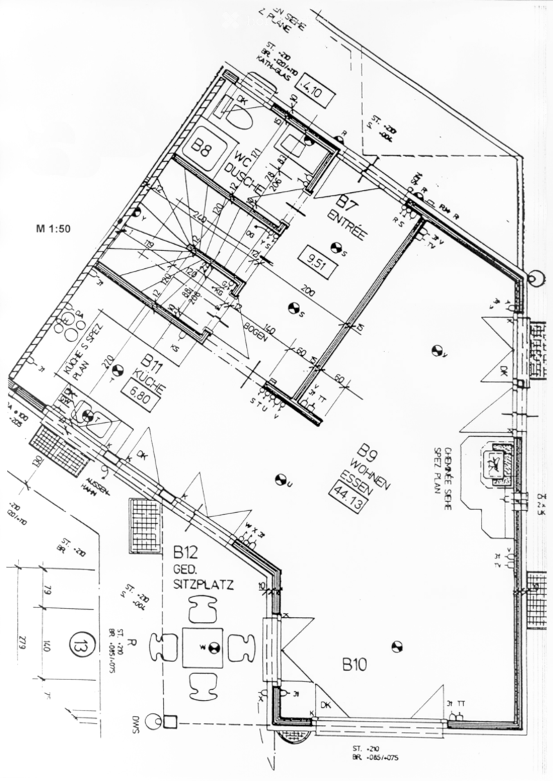 Floor plan of a residential space showing multiple rooms including a kitchen, living area, bedroom, and entrance area with labeled dimensions and room codes.