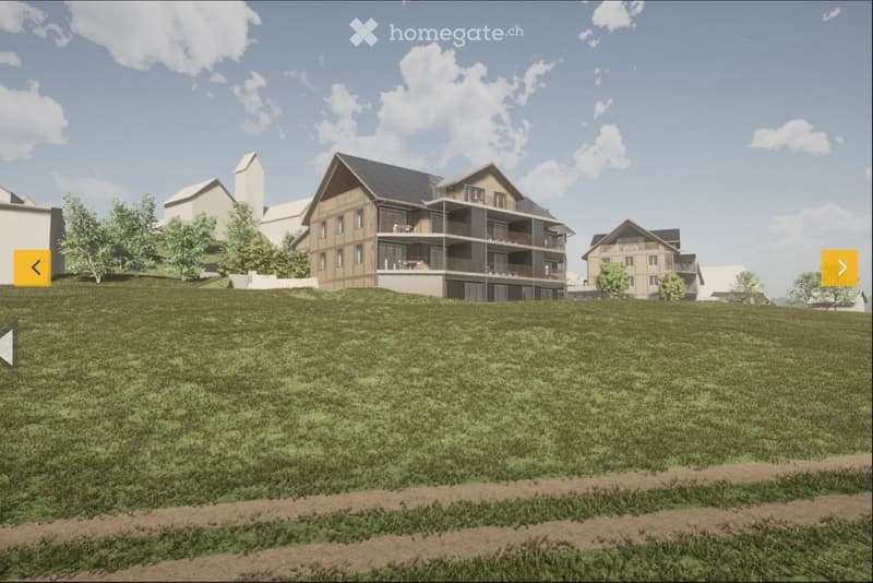 A multi-story residential building with balconies and a raised ground floor, surrounded by a grassy area and trees.