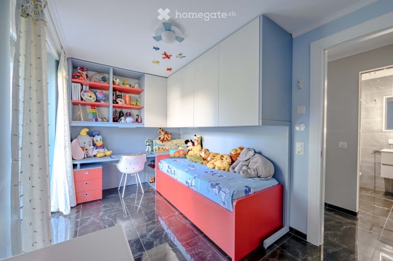 Other. {"visible_features":[],"type":"Furnished Room","objects":["bed","desk","chair","cabinet","toys","stuffed animals","lamp","curtain","tiled floor","sink","toilet","shower area","ceiling fan","ceiling lamp","airplane toys","books","clock","globe","aba