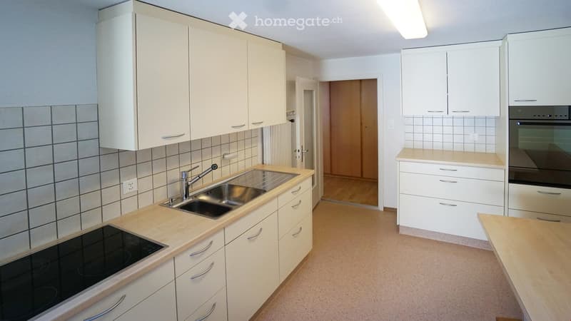 modern kitchen with white cabinets, tiled backsplash, stainless steel sink, gas stove, dishwasher, and oven