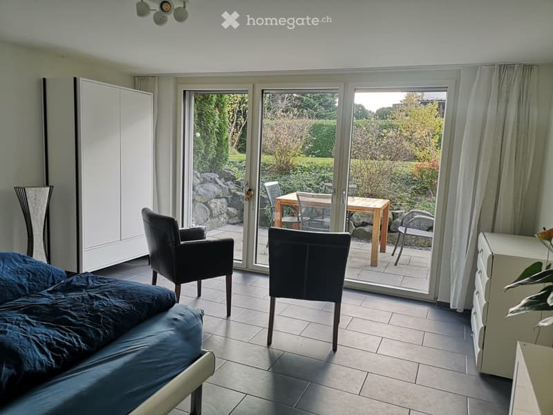{"type": "Room",    "description": "Bedroom with large windows leading to a patio with garden view",    "visible_features": ["View"],    "localized_descriptions":        {        "EN": "Bedroom with large windows leading to a patio with garden view",