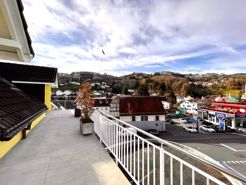 {"visible_features": ["Balcony / Terrace", "View"],    "type": "Exterior",    "description": "elevated balcony with railings and a view of a valley, plants and cars",    "localized_descriptions":        {        "EN": "Elevated balcony with railings