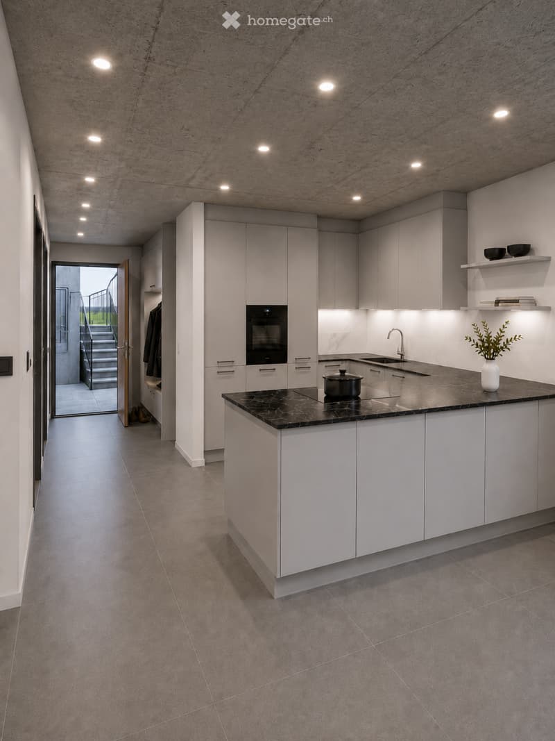 Modern kitchen with white cabinets, black marble countertop, built-in oven, sink, and decorative vase on the counter.