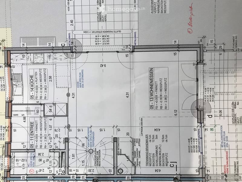 Floor plan showing layout of two apartments with labeled rooms including kitchen, entrance, living spaces, and technical areas.