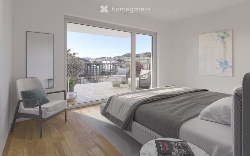 Modern bedroom with a large bed, a comfortable chair, a small table, a mirror, and a painting on the wall. The room features large windows offering a scenic view and access to a balcony with outdoor seating.