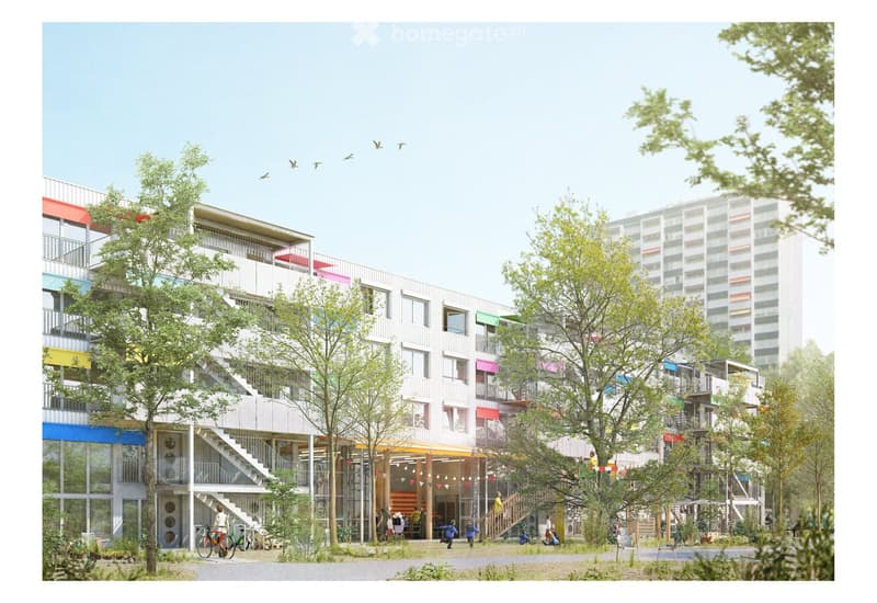 A modern multi-story residential building with colorful facades, balconies, and a central staircase leading to a communal outdoor area with trees and seating.