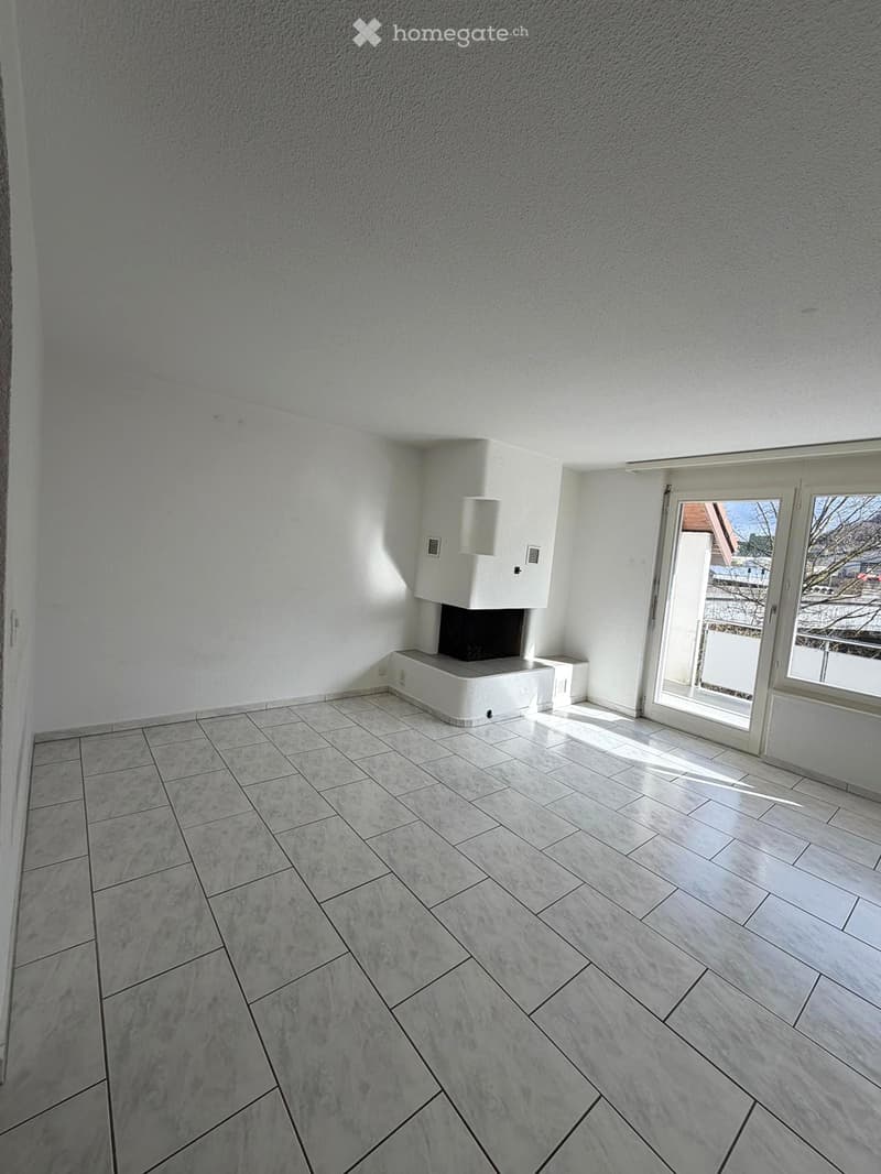 empty room, white walls, white tiles, fireplace, balcony