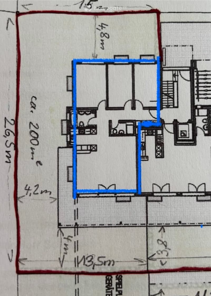 Floor plan of a residential building showing multiple rooms, including a living area, bedrooms, and bathrooms.