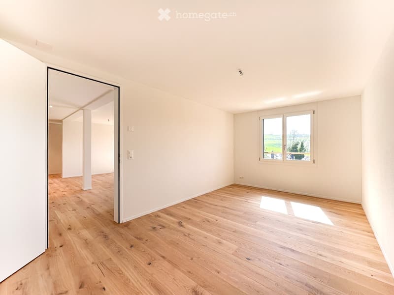 empty room, hardwood floors, white walls, natural light from window