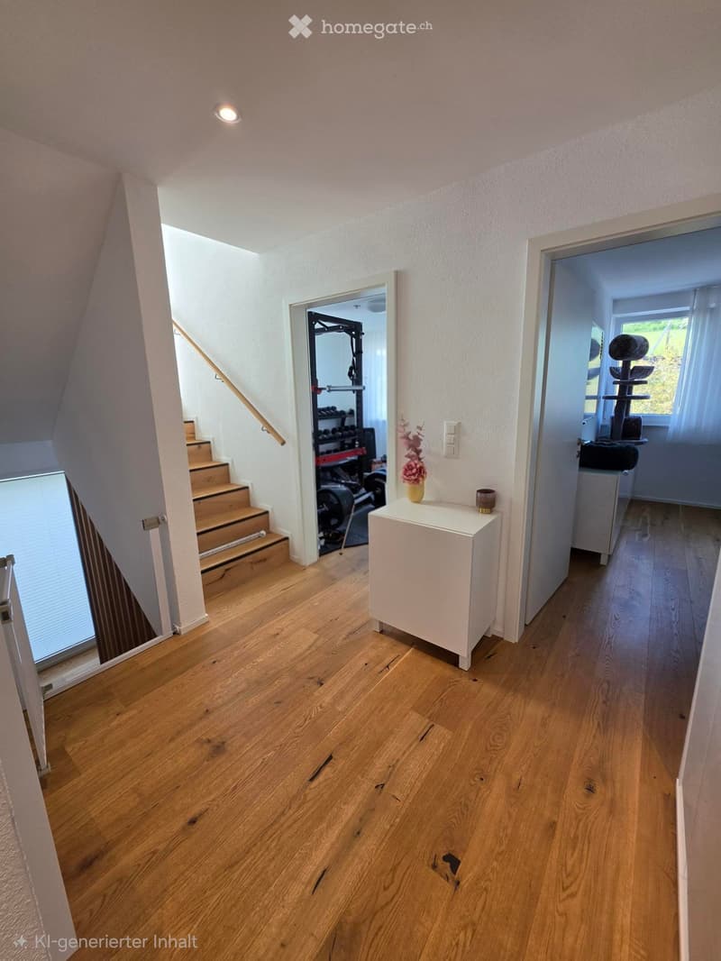 Bright hallway with wooden flooring, white walls, and recessed lighting. Features a small white side table with a vase and a candle, a staircase leading upwards, and open doors to adjacent rooms including a gym and a room with a cat tree.