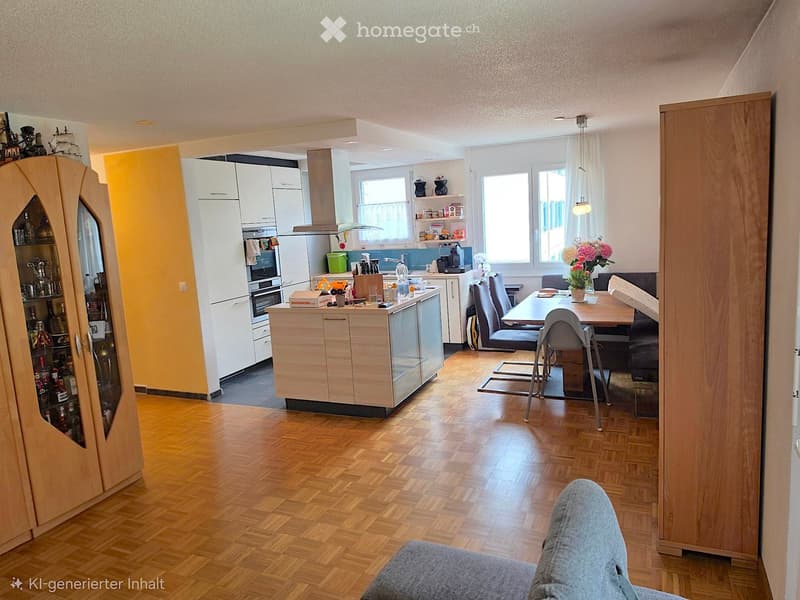 Open-plan living and dining area with a sofa, dining table, chairs, and a modern kitchen featuring white cabinets, a refrigerator, and an oven. Wooden flooring and large windows provide natural light.