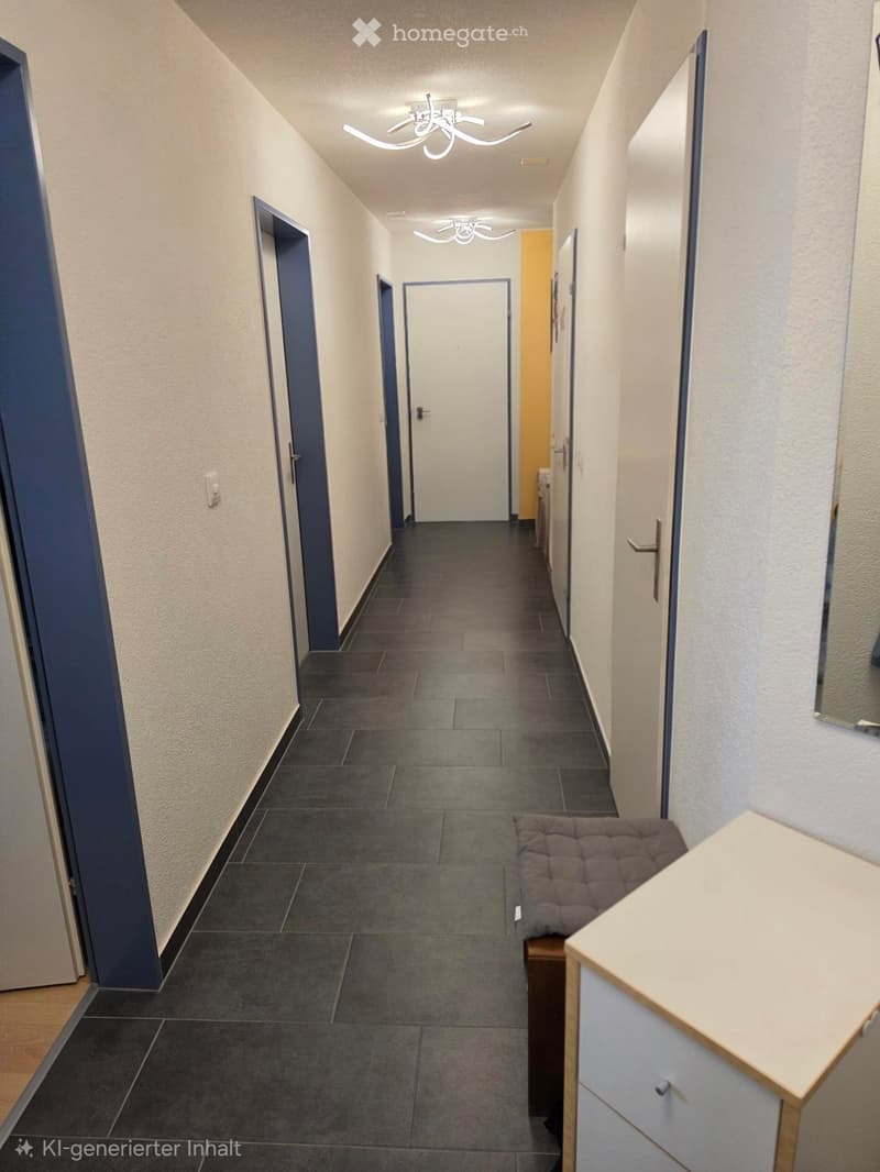 A modern hallway with dark tiled flooring, white walls, and several doors. Features include built-in storage units, a small bench, and modern lighting fixtures.