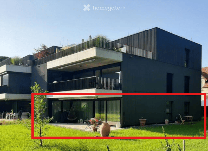 modern two-story house, black exterior, large windows, several balconies
